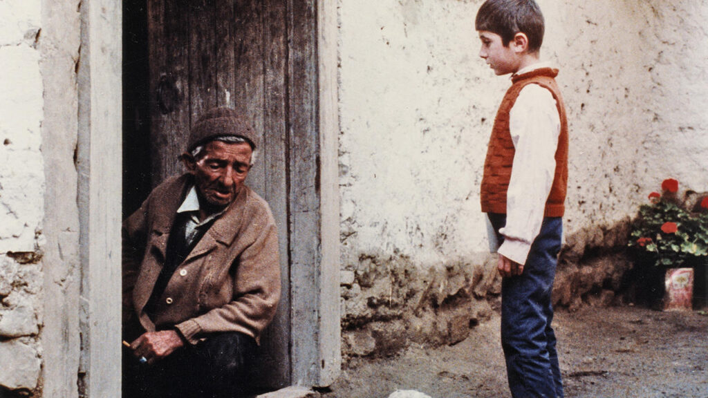 Where Is the Friend's Home? film still. Abbas Kiarostami movie scene of a boy and an older man. Iranian cinema.