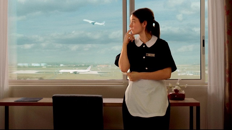 ‘Bird People’ Review | Pascale Ferran Bird People film still. A maid looks out the window at airplanes taking off. Antoine Fuqua.