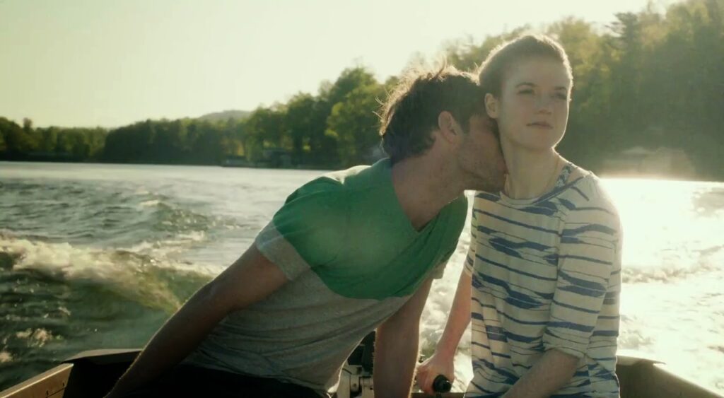 Honeymoon film still. Couple on a boat. Leigh Janiak film. Rose Leslie.