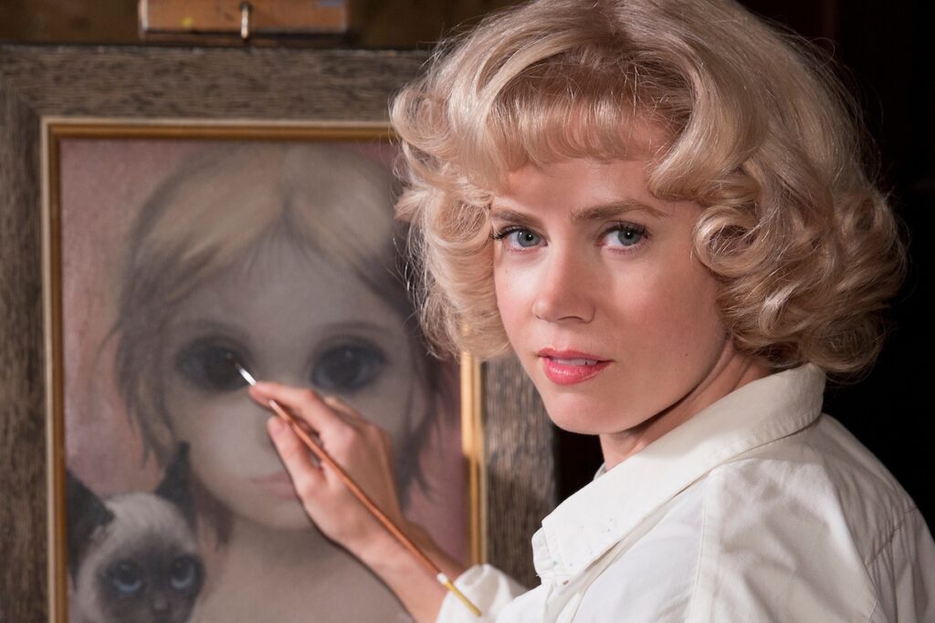 Big Eyes | Tim Burton Amy Adams as Margaret Keane painting a Big Eyes portrait in Tim Burton's film.