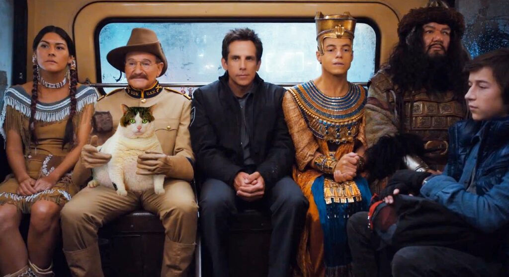 Night at the Museum: Secret of the Tomb cast on a bus. Ben Stiller, Robin Williams, Rami Malek, and more.
