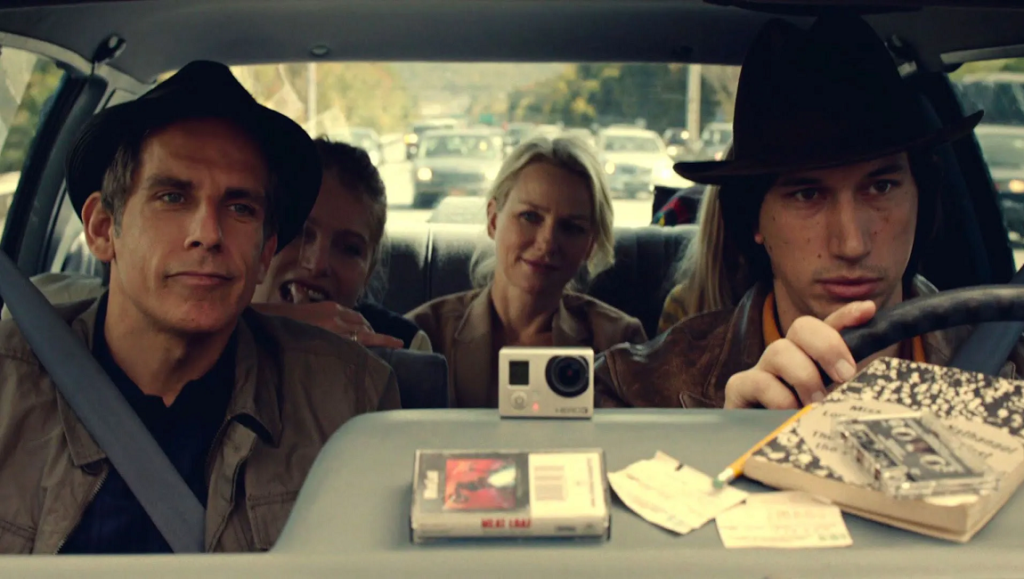 While We’re Young | Noah Baumbach While We're Young movie scene. Ben Stiller, Naomi Watts, Adam Driver in car with a GoPro camera and cassette tape.