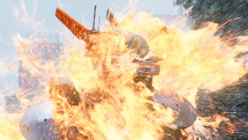 Neill Blomkamp's Chappie robot engulfed in flames. Sci-fi movie scene.