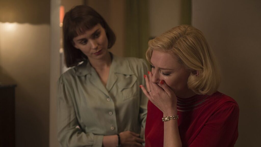 Cate Blanchett cries in Carol (2015). Rooney Mara comforts her. Todd Haynes film.