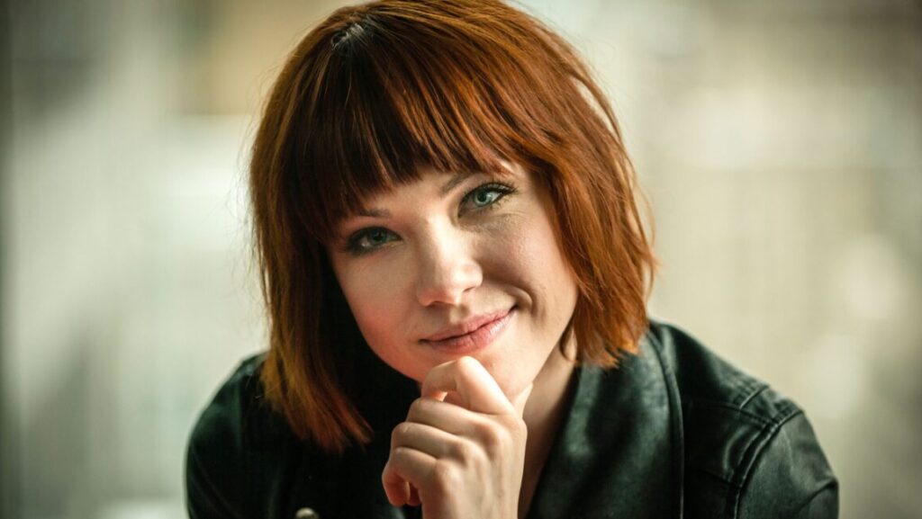 Carly Rae Jepsen, artist of one of the top albums of 2015, Emotion. Auburn hair, leather jacket.