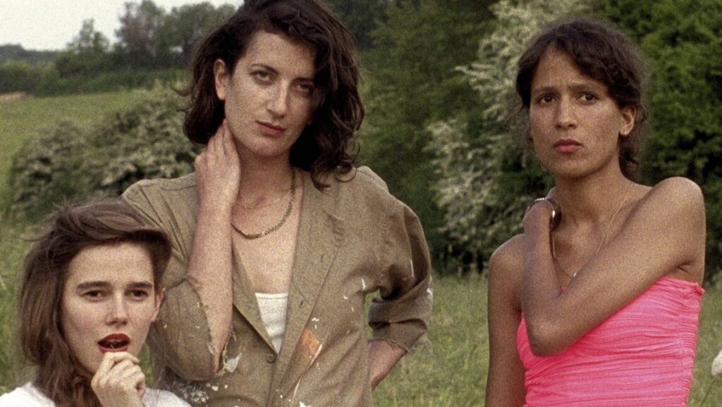 Fort Buchanan film still. Three women stand in a field. Benjamin Crotty film, 2016.