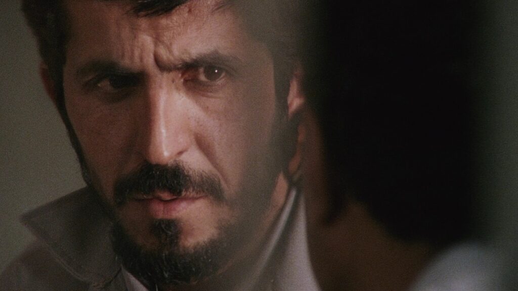 Close-Up | Abbas Kiarostami A close-up of Hossein Farazmand in Abbas Kiarostami's film Close-Up. Farazmand stares intently.