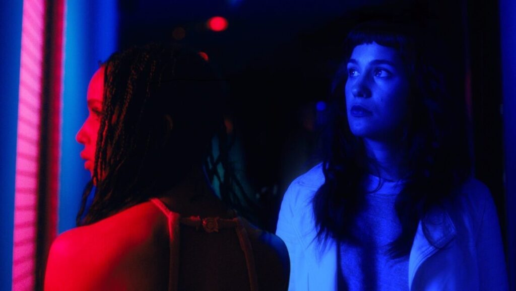 BAMcinemaFest 2017 film still. Two women in blue and red lighting at a film festival.