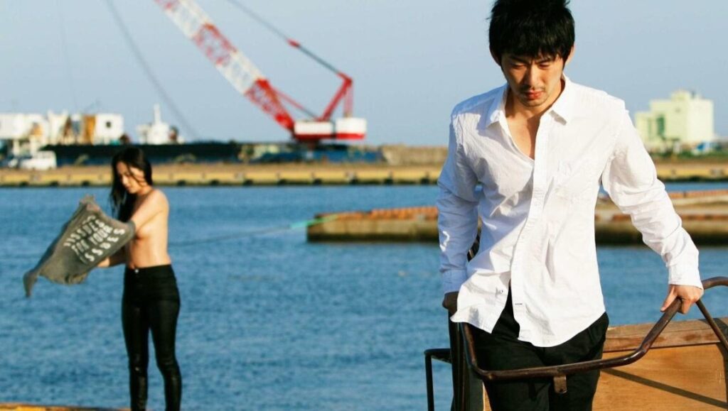 New York Asian Film Festival: Man and woman on dock near water.