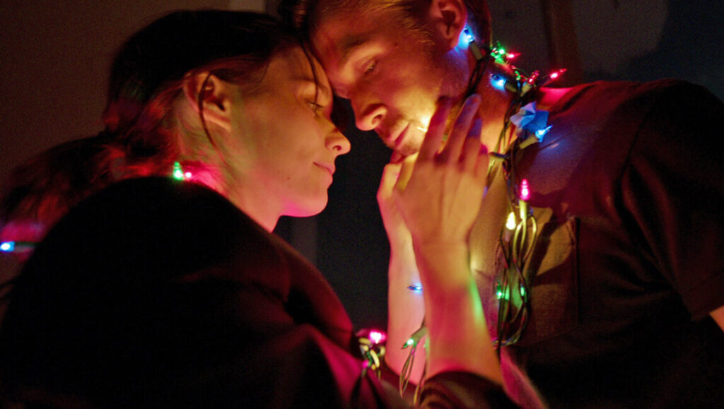 Film still. Couple with Christmas lights. Top films of 2017.