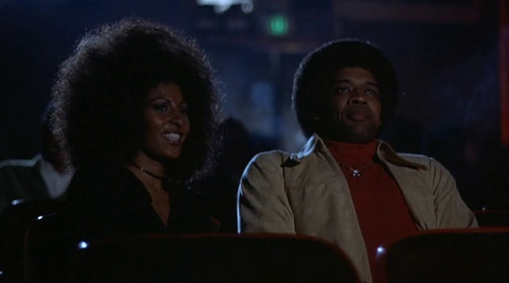 Bad Idea Podcast | Episode 33 Bad Idea Podcast Episode 33 image: Couple with afros at the movies. 70s aesthetic.