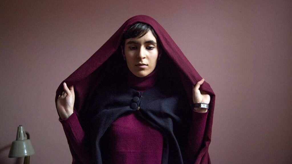 Ava film still from New Directors/New Films 2018. Woman in hooded cloak. Indie film.