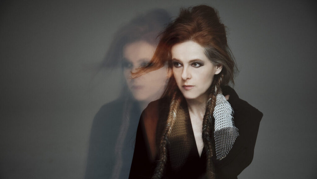Neko Case, a top album artist of 2018. Singer with braids and dark eye makeup.