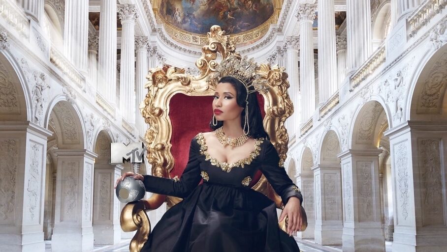 Nicki Minaj on a throne in What Would Meek Do? | Issue 2. Nicki Minaj wearing a crown and black dress.