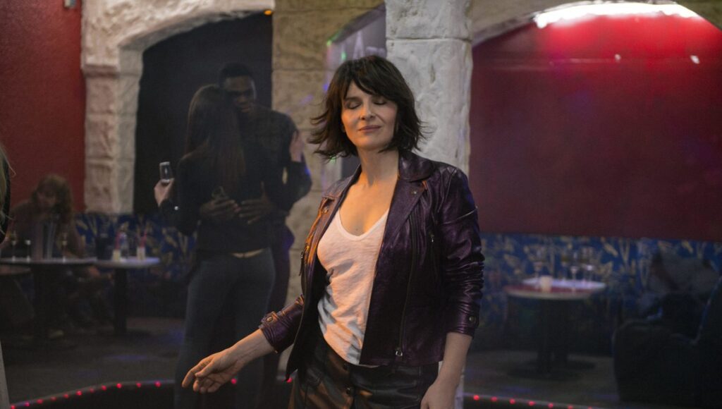 Juliette Binoche in Let the Sunshine In (Un Beau Soleil Intérieur). Claire Denis film scene with dancing.