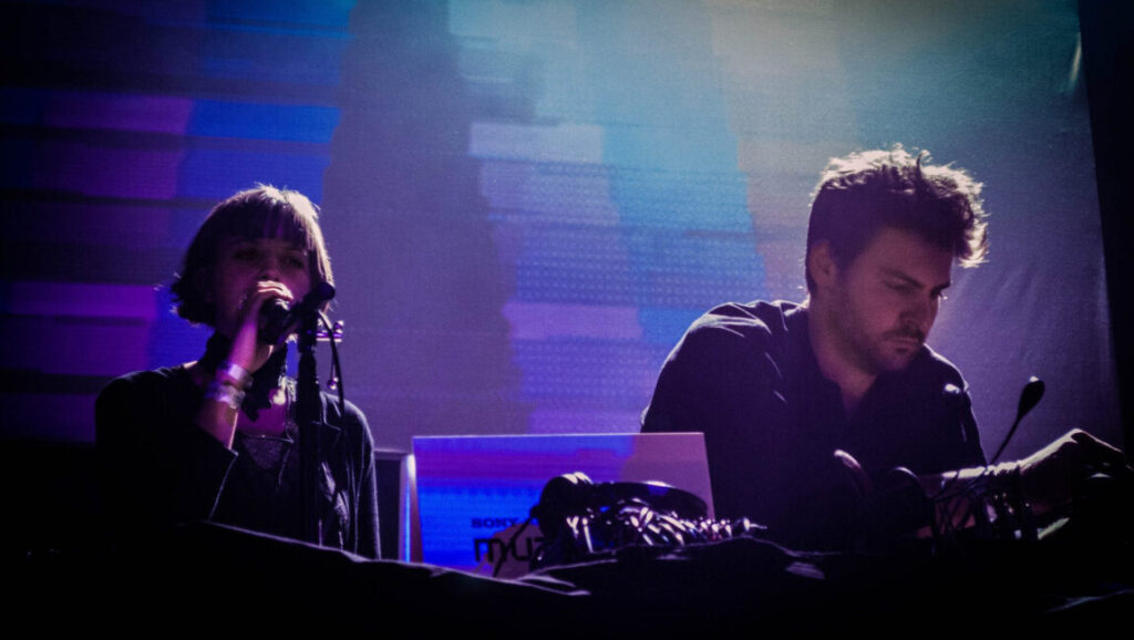 Camila Fuchs | Heart Pressed Between Stones Camila Fuchs performs Heart Pressed Between Stones live. Duo on stage with synths and microphone. Electronic music performance.