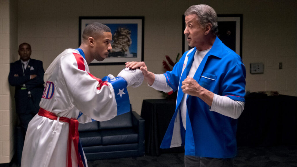 Michael B. Jordan and Sylvester Stallone in Creed II. Boxing movie scene.