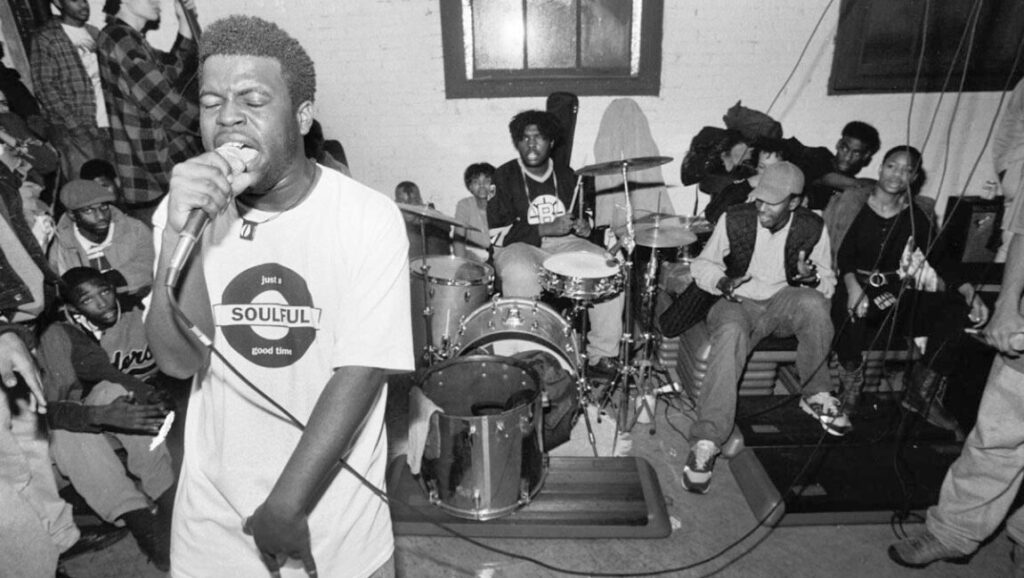 The Roots | Things Fall Apart The Roots performing live. Black and white image of the band during the Things Fall Apart era.