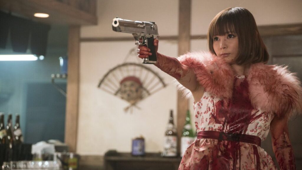 Tokyo Vampire Hotel: Woman with gun. Sion Sono film still from the Amazon Prime series.