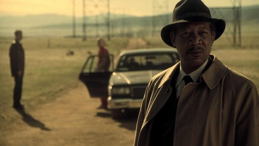 Se7en | David Fincher Morgan Freeman in Se7en, a film by David Fincher. Crime thriller scene with car and detectives.