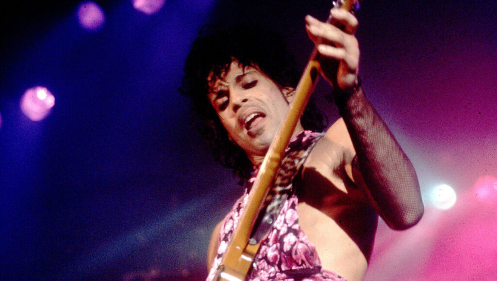 Prince performing Purple Rain with a guitar. The Revolution era.
