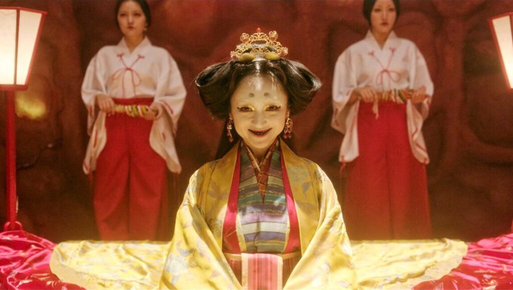 Tokyo Vampire Hotel. Woman with pale face, traditional dress, and attendants. Sion Sono film.
