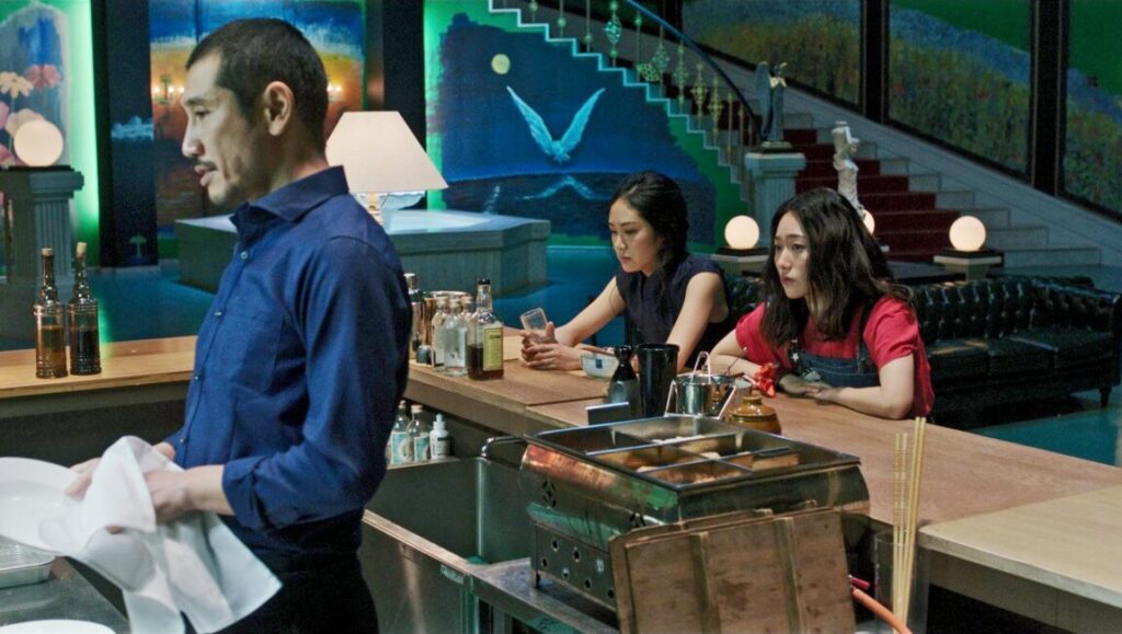 Tokyo Vampire Hotel: Sion Sono film scene. Bartender, women at bar, unique interior.