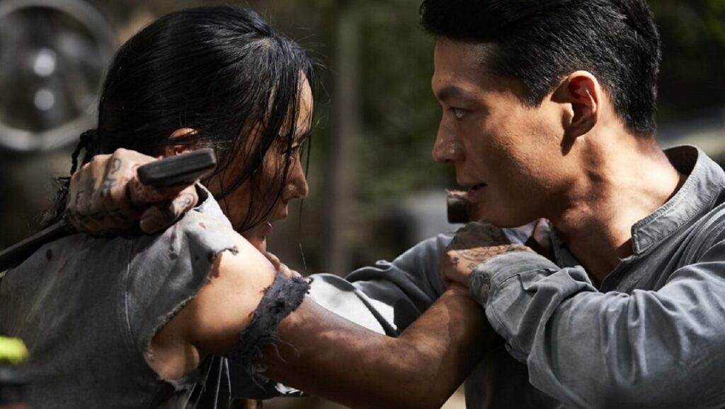 Seung-Won Lee in Revenger. Intense fight scene with determined actors. Action-packed movie still.