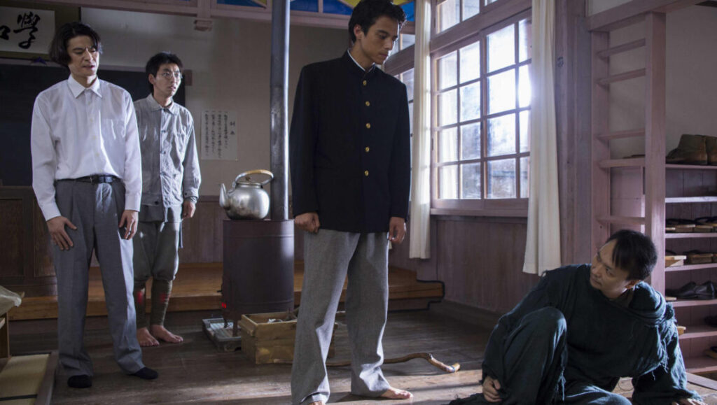 Hanagatami | Nobuhiko Obayashi Scene from *Hanagatami* by Nobuhiko Obayashi. Four men in a room, one kneeling. Japanese cinema.