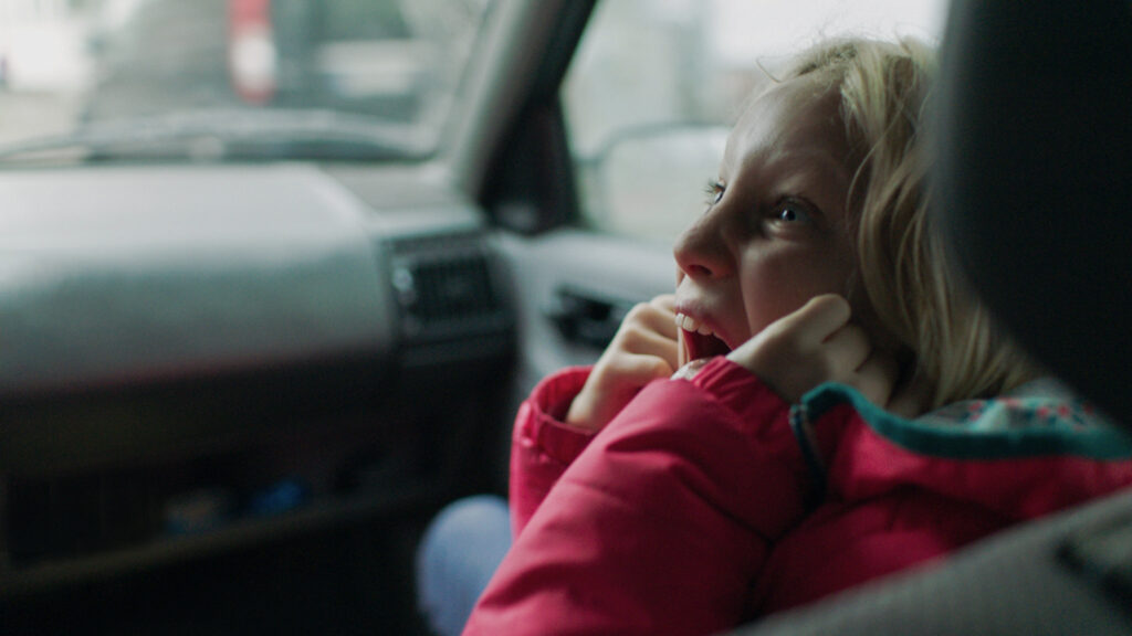 Girl screaming in car. Berlin International Film Festival 2019 film still.