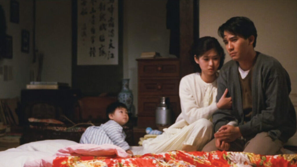 A City of Sadness film still. Family scene: man, woman, and child. Taiwanese cinema. Hou Hsiao-hsien movie.