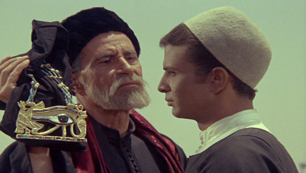 The Night of Counting the Years film still. Egyptian men with Eye of Horus artifact. Shadi Abdel Salam movie.