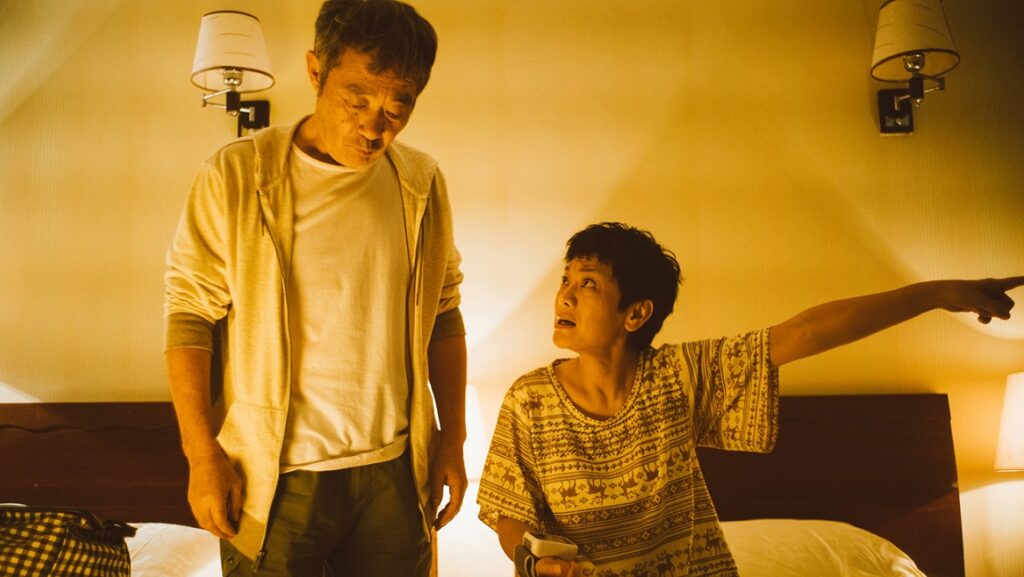 Love Education | Syvlia Chang Sylvia Chang's Love Education film still. Middle-aged couple in tense discussion. Woman pointing, man looking down.