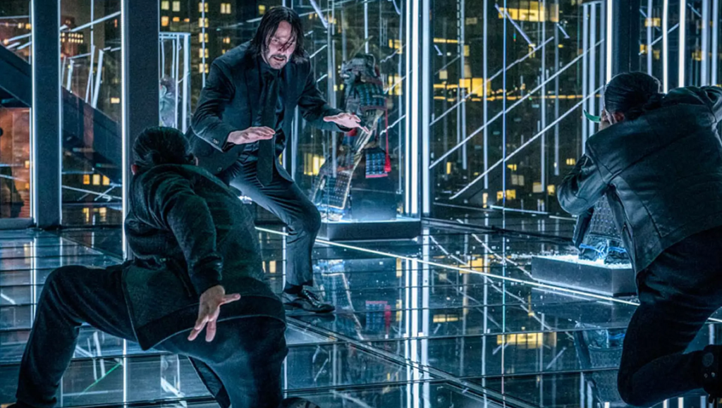John Wick Chapter 3: Parabellum | Chad Stahelski John Wick Chapter 3: Parabellum scene. Keanu Reeves in action, fighting in a glass room with city lights.