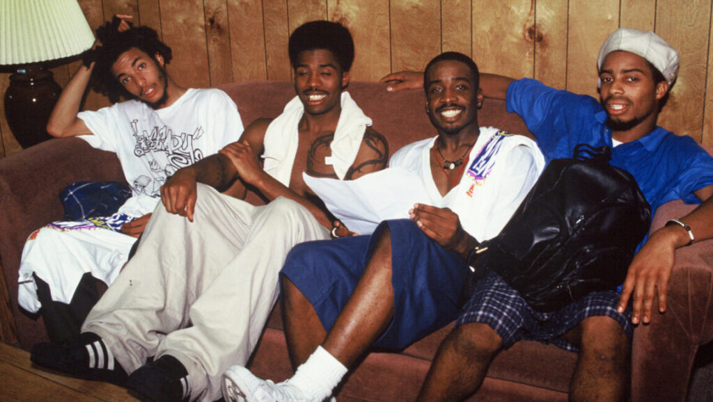 The Pharcyde | Bizarre Ride II the Pharcyde The Pharcyde group portrait. Bizarre Ride II the Pharcyde album era. 90s hip-hop group sitting on a couch.