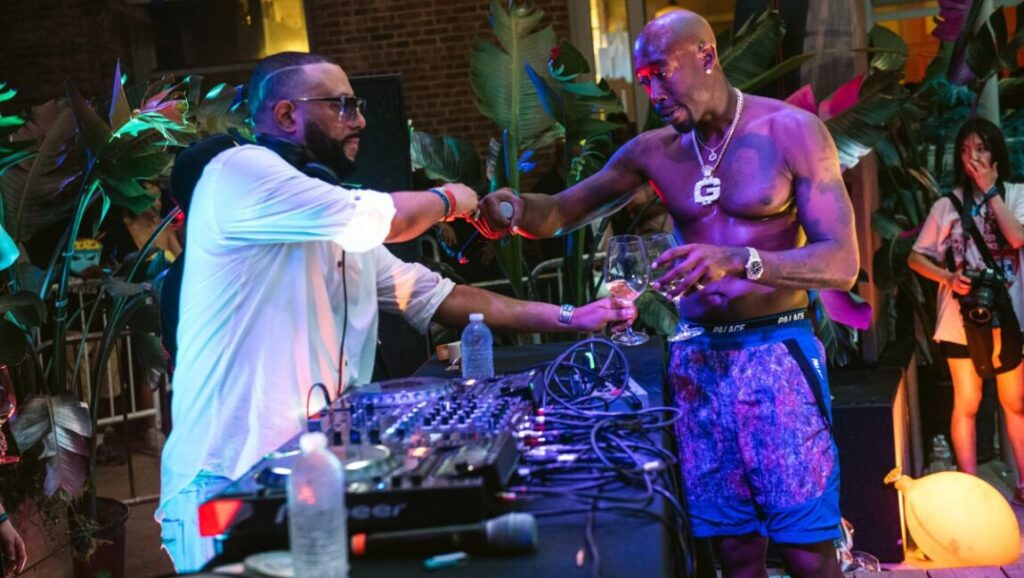 Freddie Gibbs fist bumps a DJ at a Madlib event. MOMA PS1 Warm Up party. What Would Meek Do? article.