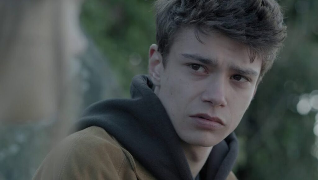 Permanent Green Light | Dennis Cooper & Zac Farley Permanent Green Light film still: A young man, Zac Farley, looks pensively to the side. Dennis Cooper film.