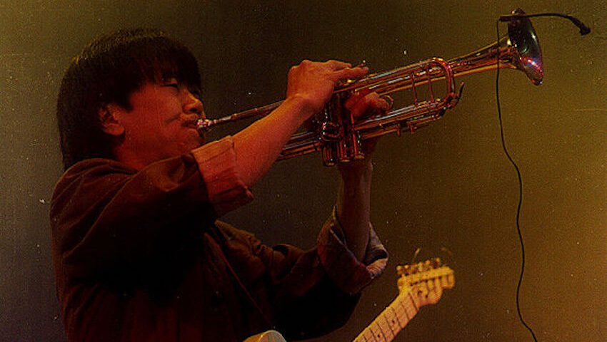 Cui Jian plays trumpet. Chinese rock music icon, 1991 performance, Solution album era.