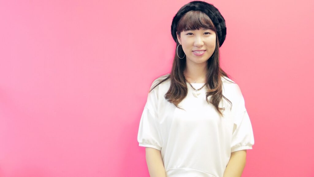 Kiki Vivi Lily | Vivid Kiki Vivi Lily, Vivid. Japanese singer with black hat on pink background. J-Pop artist.