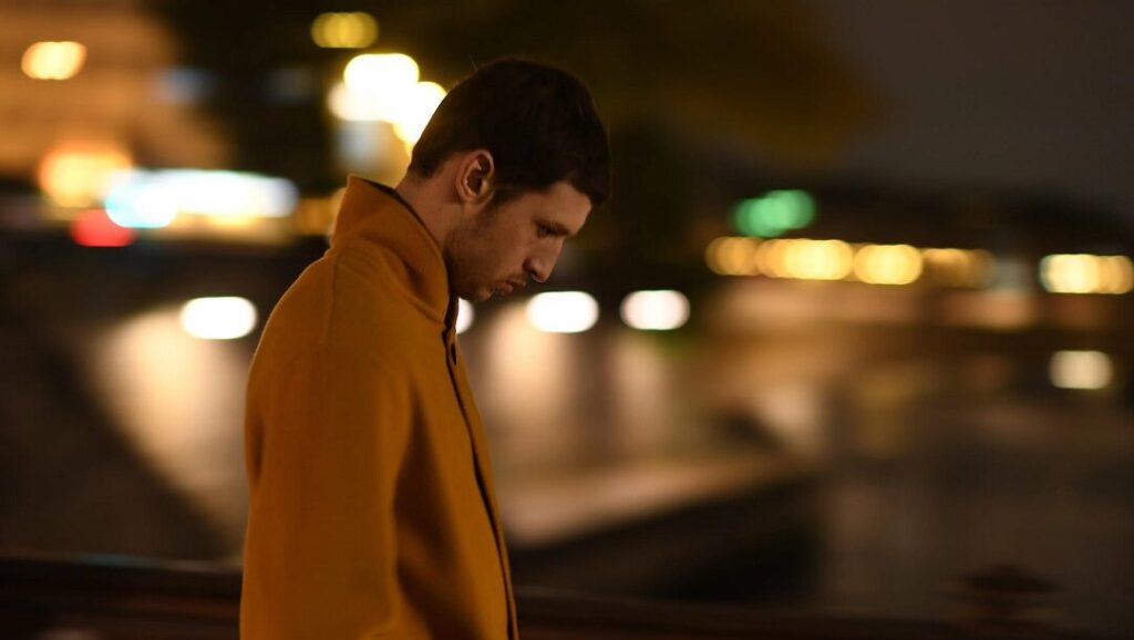 New York Film Festival 2019 | Dispatch 2: Pain and Glory, Synonyms, Zombi Child Synonyms film still. A man in a yellow coat at the New York Film Festival 2019.