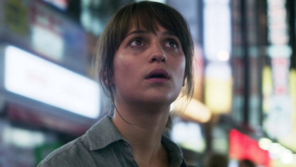 Earthquake Bird | Wash Westmoreland Alicia Vikander stars in Earthquake Bird. Close-up of the actress looking up in a scene from the film.