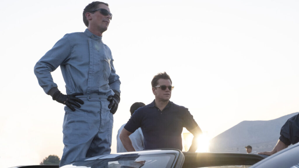 Ford v Ferrari | James Mangold Christian Bale and Matt Damon in Ford v Ferrari movie. Bale in racing suit.