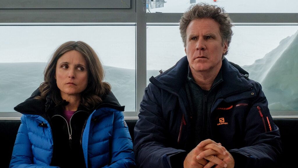 Downhill movie scene: Julia Louis-Dreyfus and Will Ferrell in winter jackets. Drama film.