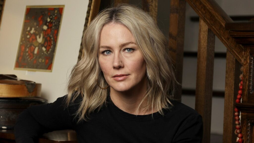 Allison Moorer, singer-songwriter. Album Blood. Portrait of Moorer with blonde hair, wearing a black top.