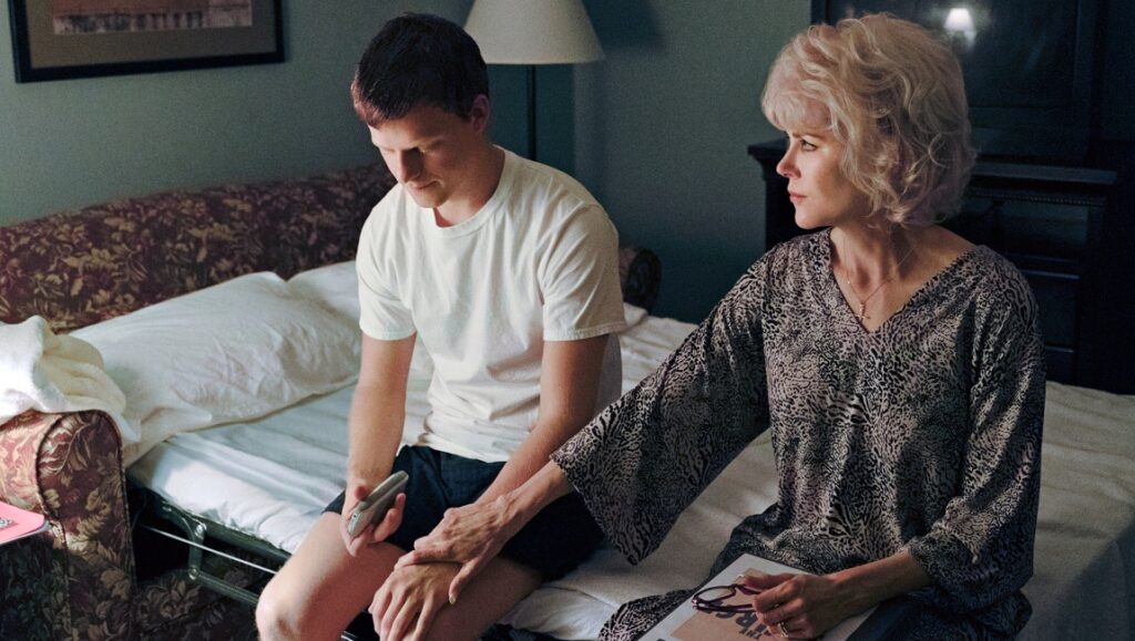 Boy Erased film scene with Nicole Kidman and Lucas Hedges on a bed.