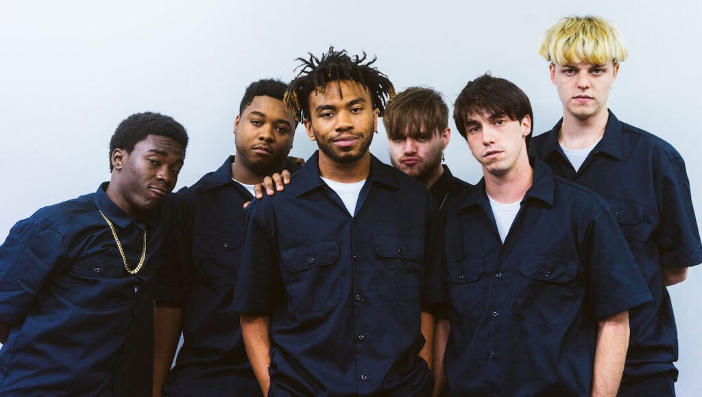 Brockhampton | Iridescence Brockhampton group portrait. Six members wearing matching blue shirts. Iridescence album era.