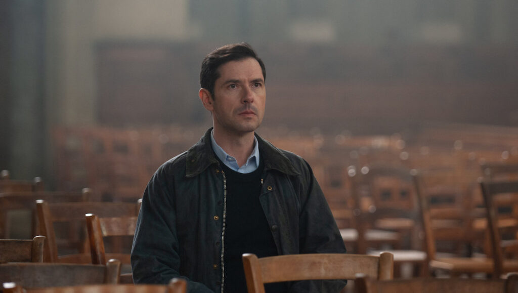 By the Grace of God | François Ozon Melvil Poupaud in By the Grace of God, directed by François Ozon. Drama film scene in a church.