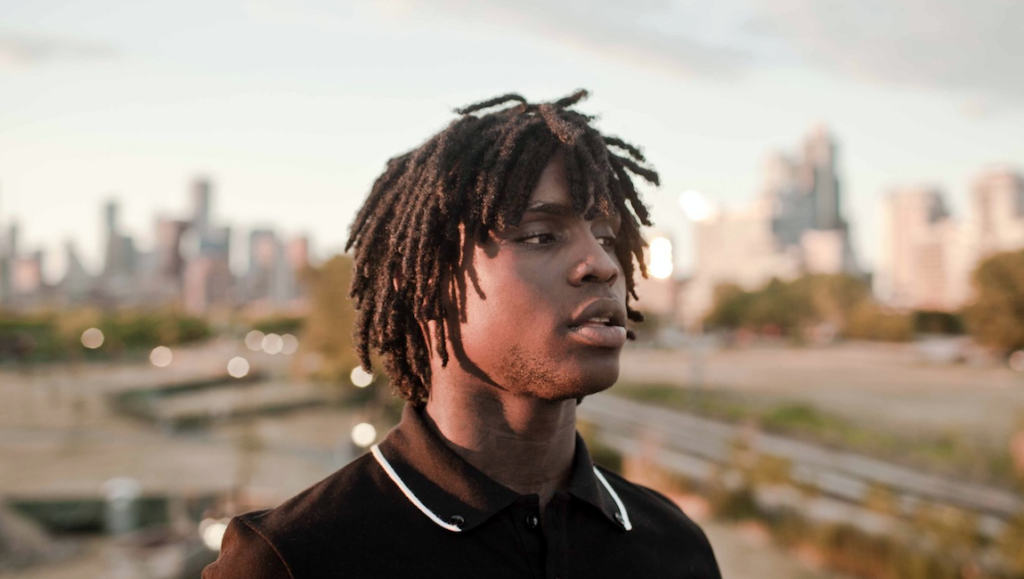 Saba | Care for Me Chief Keef, Mansion Musick era. Portrait of the rapper with dreadlocks, city skyline backdrop. Glo Gang artist.