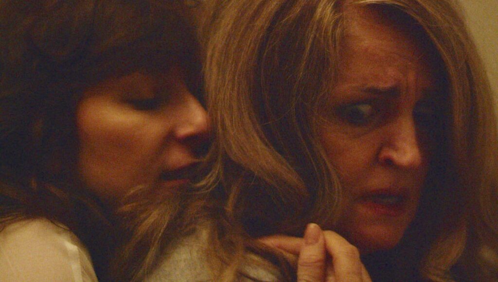 Clara's Ghost film still. Two women, one with a concerned expression, close together. Bridey Elliott film.
