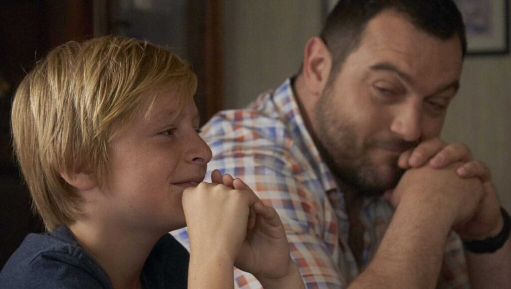 Custody | Xavier Legrand Custody movie scene: worried child with father. Family drama, child custody concept. Xavier Legrand film.